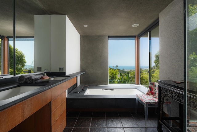 1944 Eucalyptus Hill Rd, Santa Barbara, CA 93108 - bathroom with plenty of natural light, a garden tub, double vanity, and recessed lighting