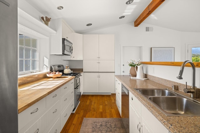 2365 Whitney Ave, Summerland, CA 93067 - kitchen featuring appliances with stainless steel finishes, dark wood-style flooring, wood counters, and white cabinetry