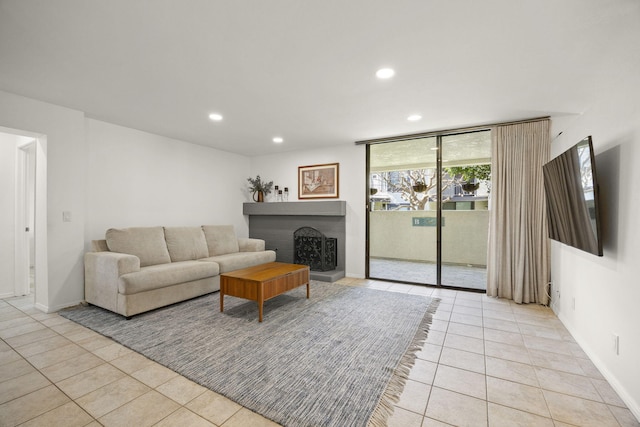 2171 Martinique Ln, Oxnard, CA 93035 - living room featuring light tile patterned floors, recessed lighting, and a fireplace with raised hearth