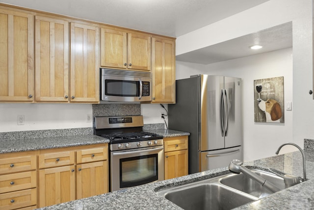 2171 Martinique Ln, Oxnard, CA 93035 - kitchen with appliances with stainless steel finishes and stone countertops