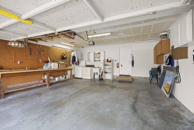 2171 Martinique Ln, Oxnard, CA 93035 - garage featuring a workshop area, a garage door opener, and independent washer and dryer