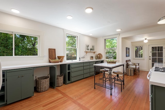 435 E Pedregosa St, Santa Barbara, CA 93101 - kitchen with green cabinets, light countertops, light wood-style floors, recessed lighting, and open shelves