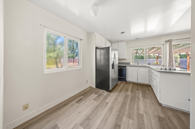 886 Raddue Ave, Santa Barbara, CA 93111 - kitchen with black appliances, light wood finished floors, white cabinetry, and light countertops