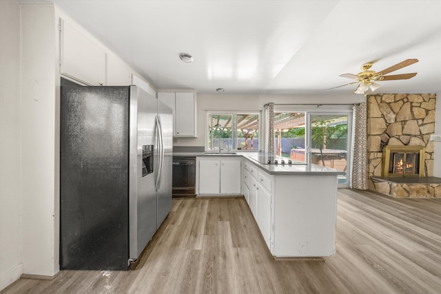 886 Raddue Ave, Santa Barbara, CA 93111 - kitchen featuring stainless steel refrigerator with ice dispenser, light wood finished floors, dishwasher, a peninsula, and a stone fireplace