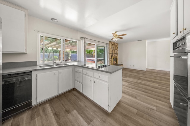 886 Raddue Ave, Santa Barbara, CA 93111 - kitchen with black appliances, a ceiling fan, wood finished floors, and white cabinets