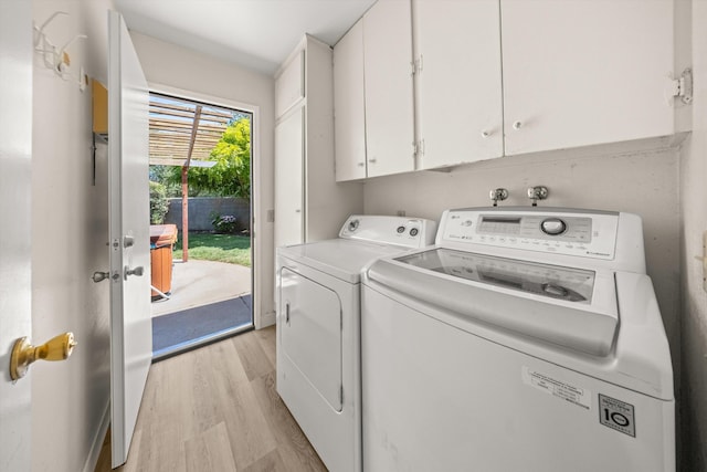 886 Raddue Ave, Santa Barbara, CA 93111 - washroom with cabinet space, washer and clothes dryer, and light wood-style floors