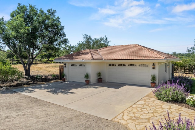 1740 Still Meadow Rd, Solvang, CA 93463 - view of front of property with stucco siding, driveway, an attached garage, and a tile roof