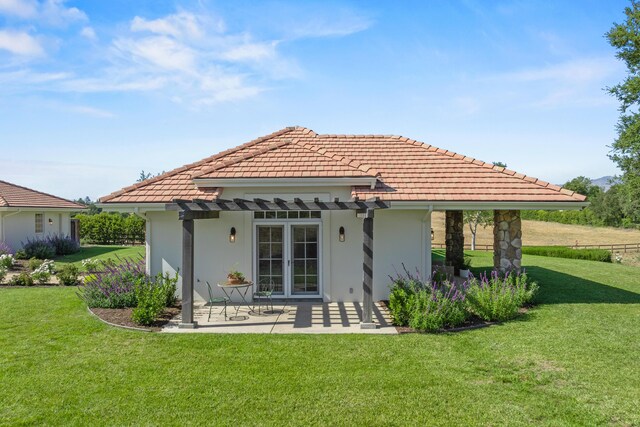 1740 Still Meadow Rd, Solvang, CA 93463 - rear view of property featuring a pergola, a tiled roof, stucco siding, and a lawn