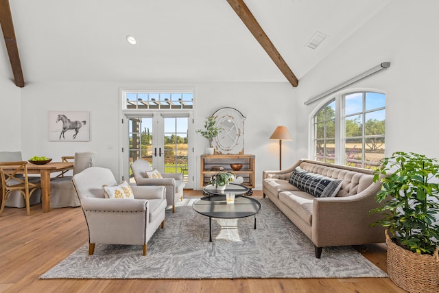 1740 Still Meadow Rd, Solvang, CA 93463 - living area featuring beamed ceiling, healthy amount of natural light, wood finished floors, french doors, and high vaulted ceiling