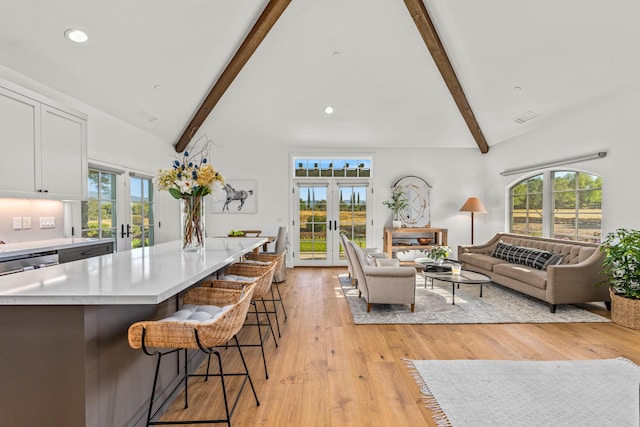 1740 Still Meadow Rd, Solvang, CA 93463 - living area with french doors, beamed ceiling, healthy amount of natural light, recessed lighting, and light wood-type flooring