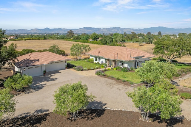 1740 Still Meadow Rd, Solvang, CA 93463 - view of front of house with a tiled roof, an attached garage, dirt driveway, and a mountain view
