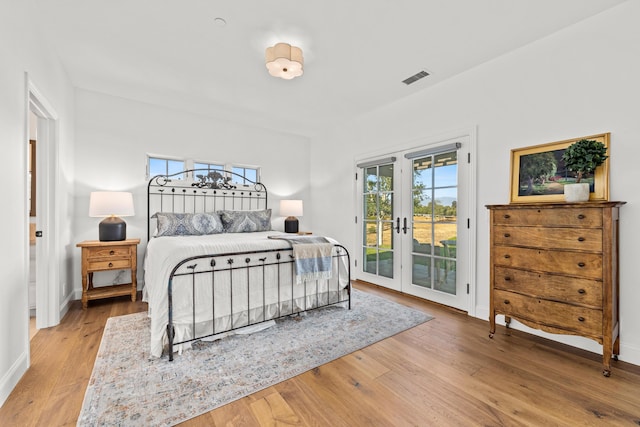 1740 Still Meadow Rd, Solvang, CA 93463 - bedroom with access to exterior, light wood-style floors, and french doors