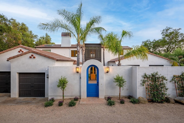 2641 Dorking Pl, Santa Barbara, CA 93105 - mediterranean / spanish-style home featuring a garage, stucco siding, and a chimney