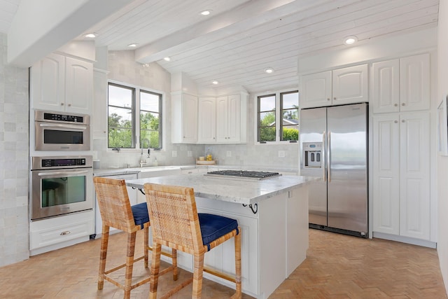 2641 Dorking Pl, Santa Barbara, CA 93105 - kitchen with stainless steel appliances, plenty of natural light, white cabinetry, and recessed lighting