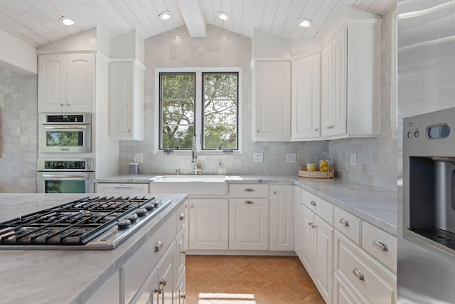 2641 Dorking Pl, Santa Barbara, CA 93105 - kitchen featuring stainless steel appliances, white cabinets, decorative backsplash, recessed lighting, and light stone countertops