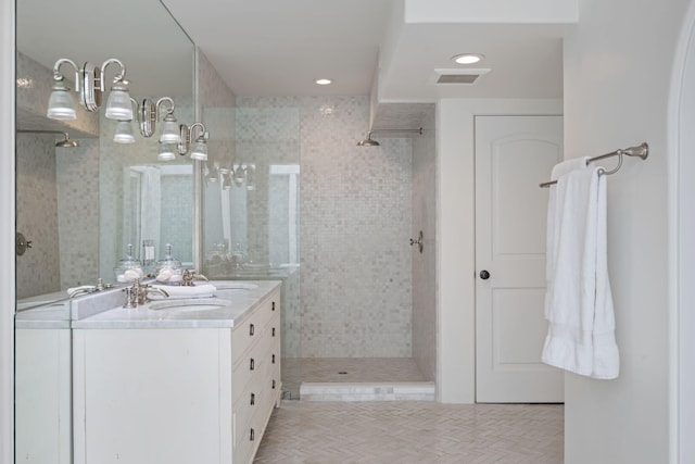 2641 Dorking Pl, Santa Barbara, CA 93105 - full bathroom featuring double vanity, a tile shower, and recessed lighting