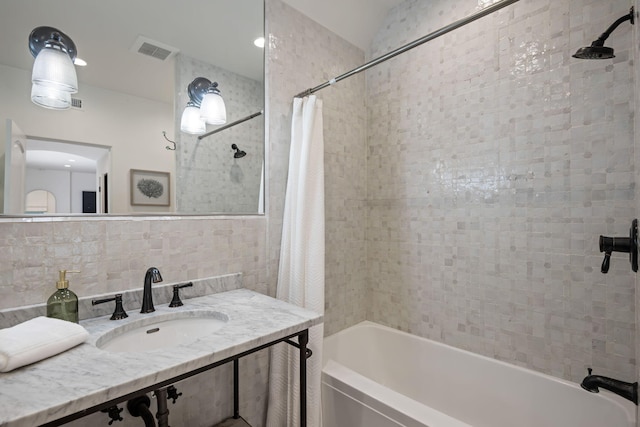 2641 Dorking Pl, Santa Barbara, CA 93105 - bathroom with shower / bath combo, vanity, and tile walls