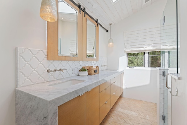 2641 Dorking Pl, Santa Barbara, CA 93105 - full bath with double vanity, decorative backsplash, a shower with door, and vaulted ceiling