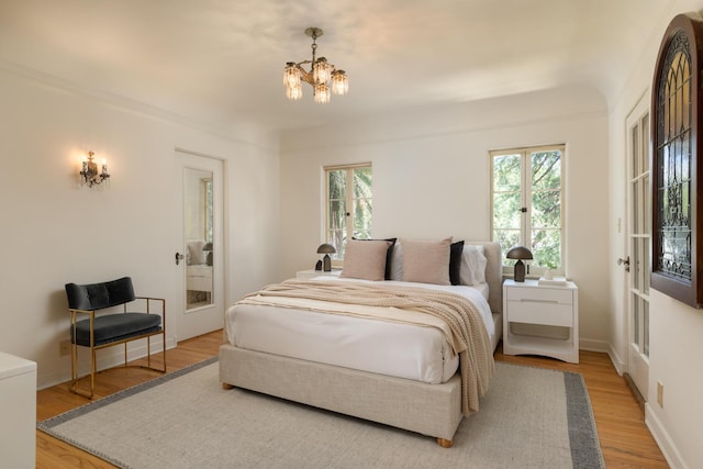 205 S Lomita Ave, Ojai, CA 93023 - bedroom with a chandelier and wood finished floors