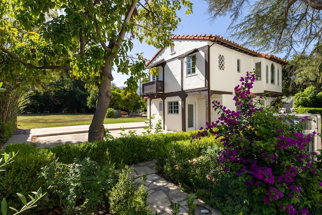 205 S Lomita Ave, Ojai, CA 93023 - back of property with a balcony, stucco siding, and a tiled roof