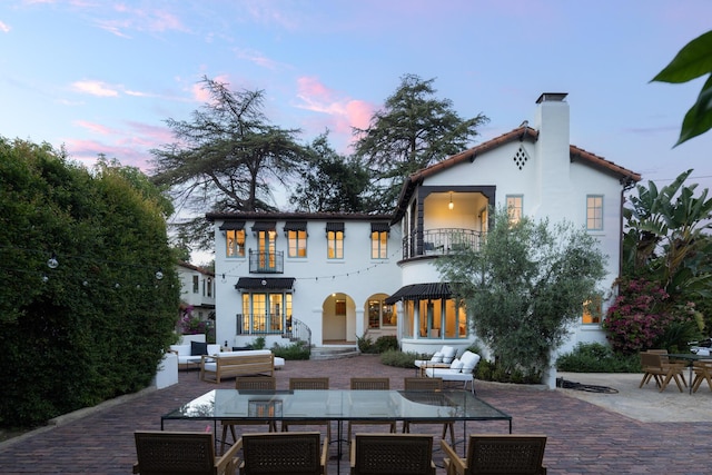 205 S Lomita Ave, Ojai, CA 93023 - rear view of property featuring a balcony, outdoor dining area, a patio area, and stucco siding
