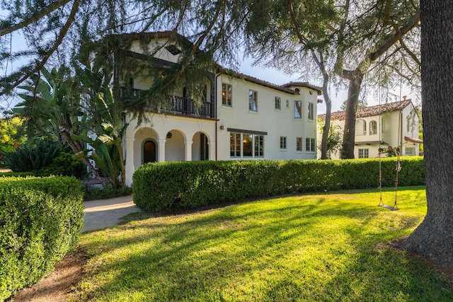 205 S Lomita Ave, Ojai, CA 93023 - view of front facade featuring a balcony, a front yard, and stucco siding
