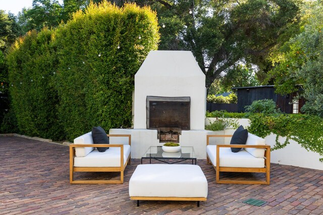 205 S Lomita Ave, Ojai, CA 93023 - view of patio / terrace with an outdoor fireplace