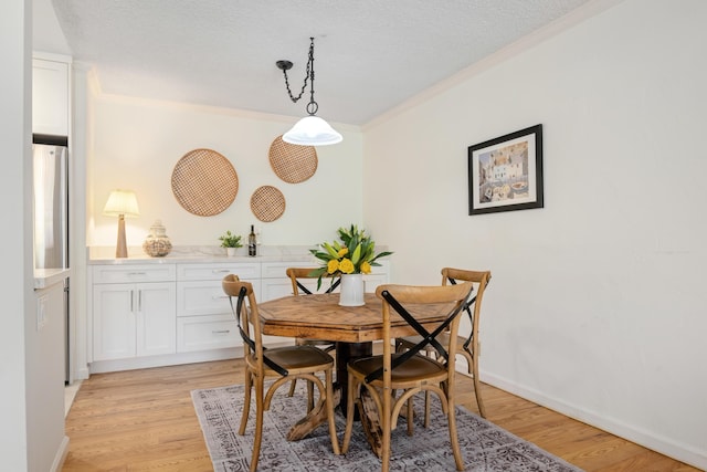 2727 Miradero Dr Unit 209, Santa Barbara, CA 93105 - dining room featuring ornamental molding and light wood-style flooring
