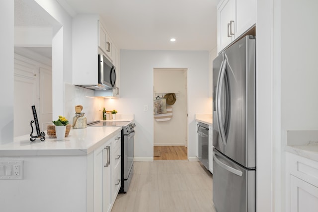 2727 Miradero Dr Unit 209, Santa Barbara, CA 93105 - kitchen with stainless steel appliances, white cabinetry, light countertops, and recessed lighting