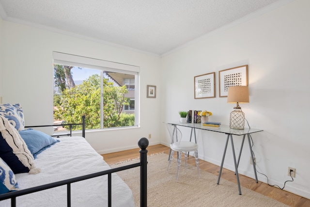 2727 Miradero Dr Unit 209, Santa Barbara, CA 93105 - bedroom featuring wood finished floors, crown molding, and a textured ceiling
