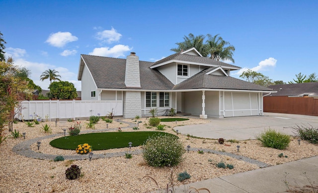 622 Colfax Ct, Goleta, CA 93117 - traditional-style home with driveway, roof with shingles, a chimney, an attached garage, and stucco siding