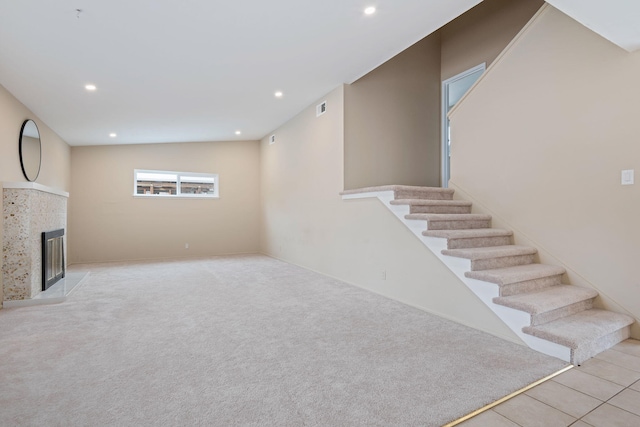 622 Colfax Ct, Goleta, CA 93117 - basement featuring recessed lighting, a tile fireplace, carpet, and stairs