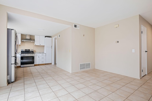 622 Colfax Ct, Goleta, CA 93117 - kitchen with appliances with stainless steel finishes, wall chimney range hood, light countertops, white cabinets, and light tile patterned floors