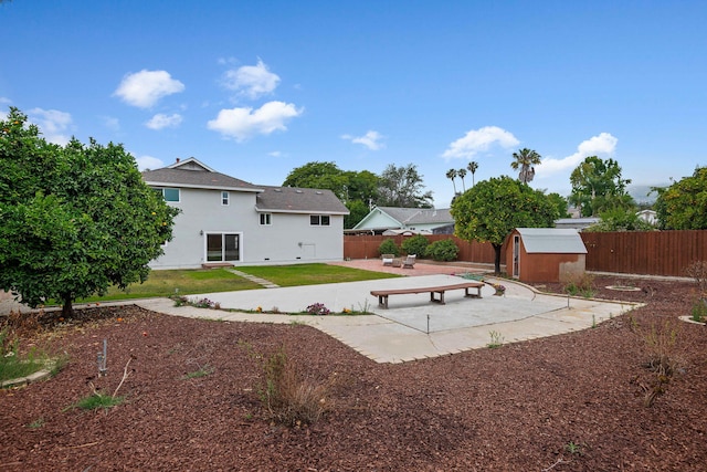 622 Colfax Ct, Goleta, CA 93117 - rear view of property featuring a storage shed, a patio area, a fenced backyard, and stucco siding