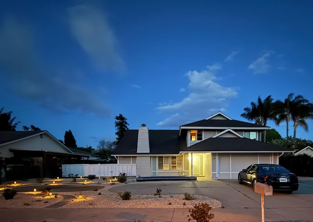 622 Colfax Ct, Goleta, CA 93117 - traditional-style home featuring concrete driveway, an attached garage, and a chimney