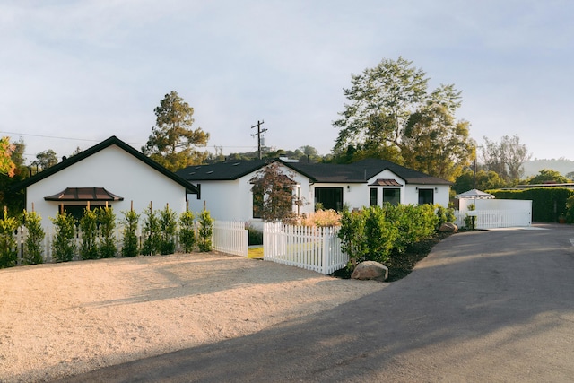 251 Cloydon Cir, Montecito, CA 93108 - view of front facade with a fenced front yard, a gate, and driveway