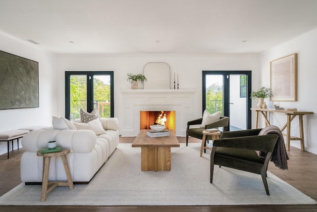 251 Cloydon Cir, Montecito, CA 93108 - living area with wood finished floors, a warm lit fireplace, and crown molding