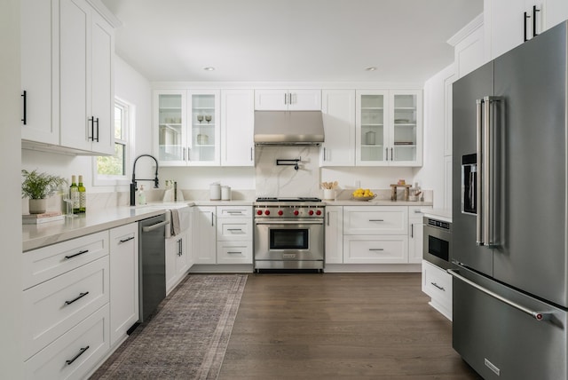 251 Cloydon Cir, Montecito, CA 93108 - kitchen with high quality appliances, under cabinet range hood, light countertops, white cabinets, and recessed lighting