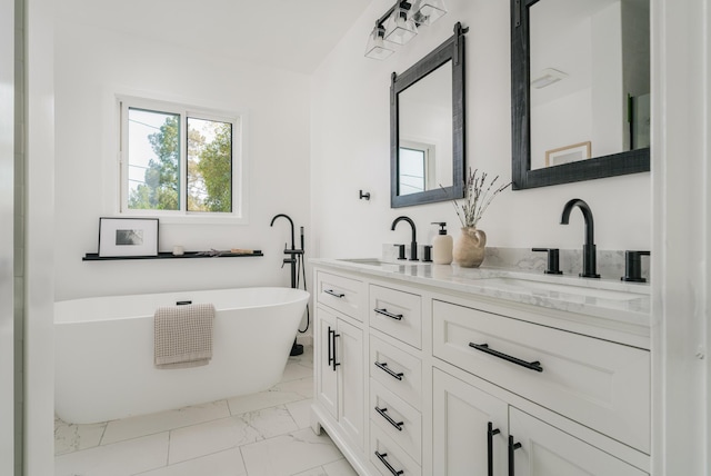 251 Cloydon Cir, Montecito, CA 93108 - bathroom featuring marble finish flooring, double vanity, and a freestanding tub