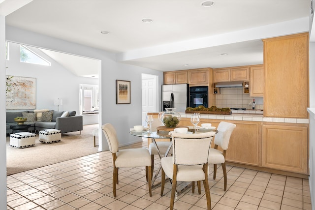 5668 Encina Rd, Goleta, CA 93117 - dining room with light colored carpet, light tile patterned floors, and recessed lighting