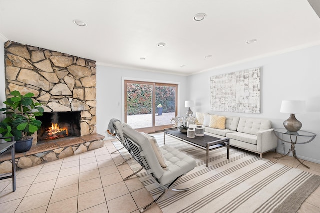 5668 Encina Rd, Goleta, CA 93117 - living area with ornamental molding, light tile patterned flooring, a stone fireplace, and recessed lighting