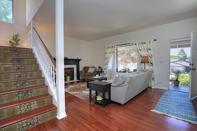4014 Primavera Rd Unit A, Santa Barbara, CA 93110 - living area featuring a tiled fireplace, wood finished floors, and stairway