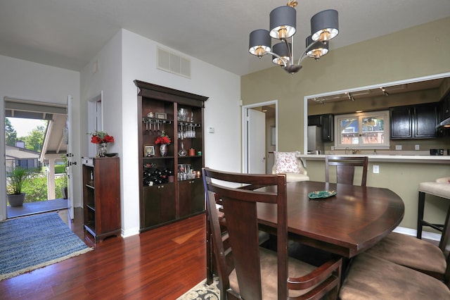 4014 Primavera Rd Unit A, Santa Barbara, CA 93110 - dining space with dark wood-type flooring and a chandelier
