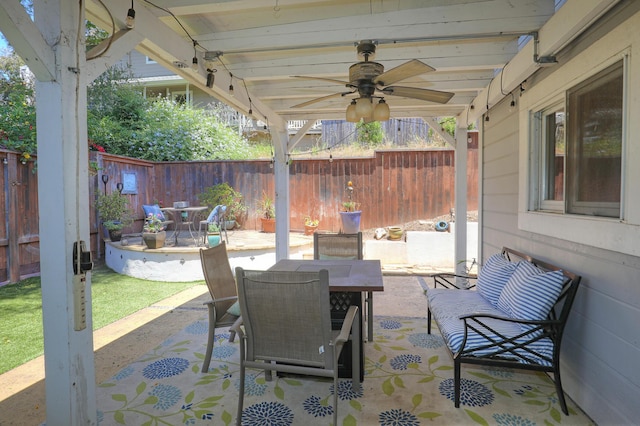 4014 Primavera Rd Unit A, Santa Barbara, CA 93110 - fenced backyard with outdoor dining area, ceiling fan, and a patio area