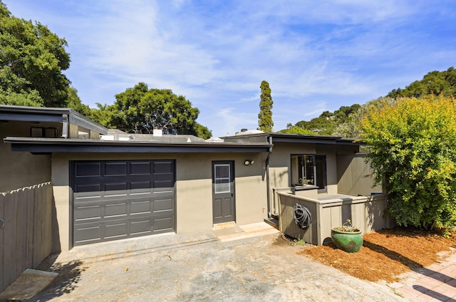 1330 W Valerio St, Santa Barbara, CA 93101 - mid-century inspired home with asphalt driveway, a garage, and stucco siding