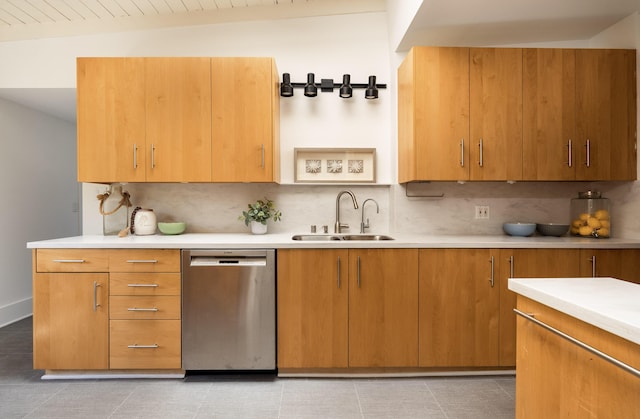 1330 W Valerio St, Santa Barbara, CA 93101 - kitchen featuring stainless steel dishwasher, decorative backsplash, light countertops, and brown cabinets