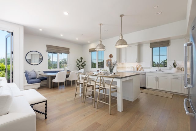 3718 State St Unit 314, Santa Barbara, CA 93105 - kitchen featuring open floor plan, recessed lighting, light wood-type flooring, stainless steel appliances, and a center island