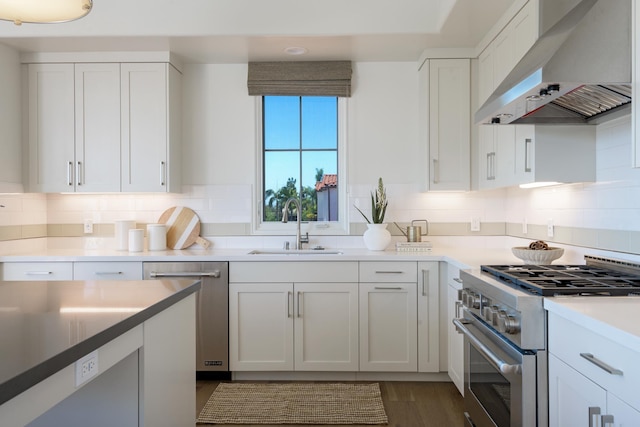 3718 State St Unit 314, Santa Barbara, CA 93105 - kitchen with ventilation hood, appliances with stainless steel finishes, white cabinetry, and backsplash