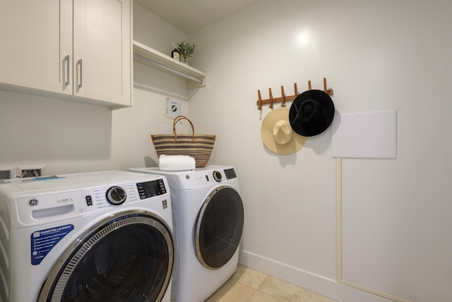 3718 State St Unit 314, Santa Barbara, CA 93105 - laundry room featuring cabinet space, washing machine and clothes dryer, and light tile patterned flooring
