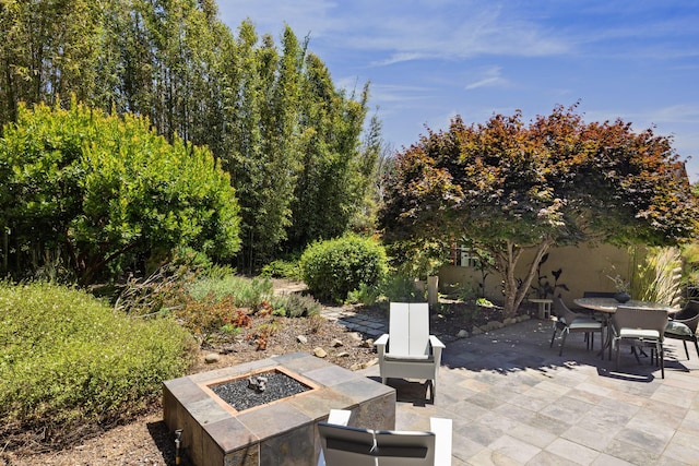 1138 Vallecito Rd, Carpinteria, CA 93013 - view of patio with an outdoor fire pit and outdoor dining area